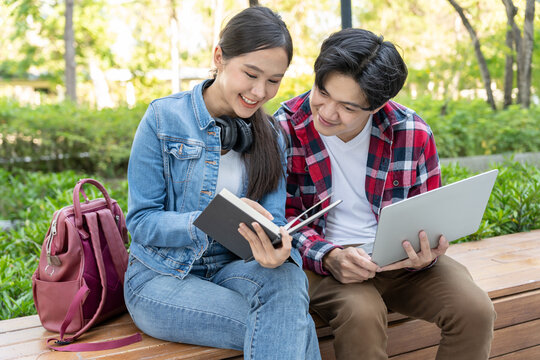 Group Asian student meeting team for work project. team happy study. Use laptop in college campus. Group on international Asia University. Education, study, school, college, graduation