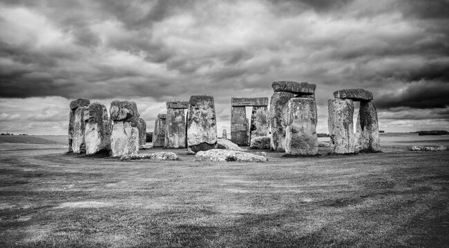 Black and White Pano view of Stonehenge Stone Circle Under Dramatic Sky, Amesbury, Wiltshire, England, UK, Europe.