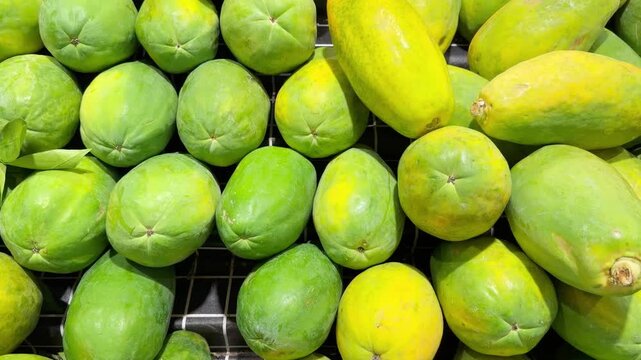 Fresh Tropical Fruits on Display in Supermarket Produce Section &ndash; Assorted Mangoes, Dragon Fruit and Passion Fruit Stacked at the Vegetable Counter