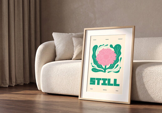 Frame Mockup Leaning on Floor Against White Sofa in Living Room