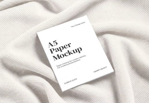 A5 Paper Mockup on Textured Fabric Background