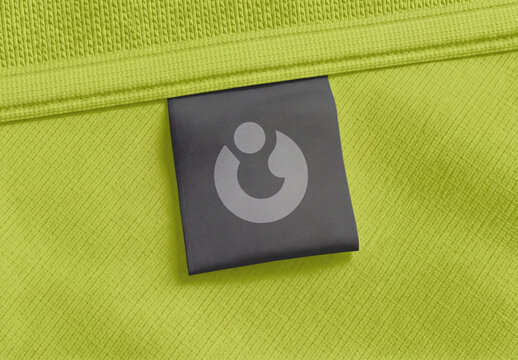 Close Up of Clothing Label Tag Mockup on Green Fabric