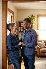 Fototapeta premium Couple enjoys a moment together in their cozy living room during a sunny afternoon