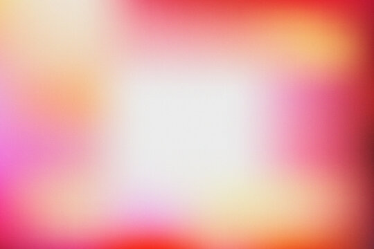 Abstract red and orange gradient background with soft grainy texture and light center