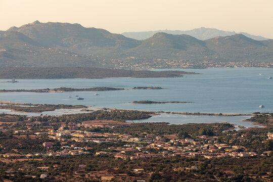 aerial full view of Olbia gulf with Murta Maria in foreground, landmark lighthouse and pittulongu in the background, pupular tourists attractions, holidays, vacations