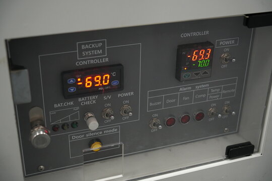 A control panel of an ultra low temperature freezer displays minus sixty nine degrees.