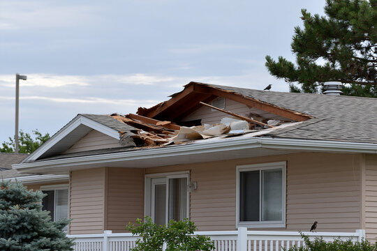 Roof damage observed on a house after a storm