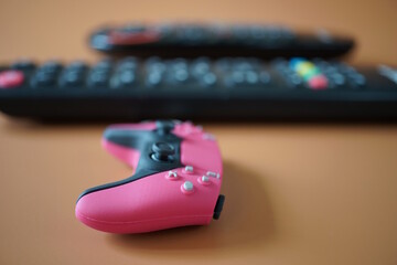 A toy game joystick on a brown background. © Станислав 