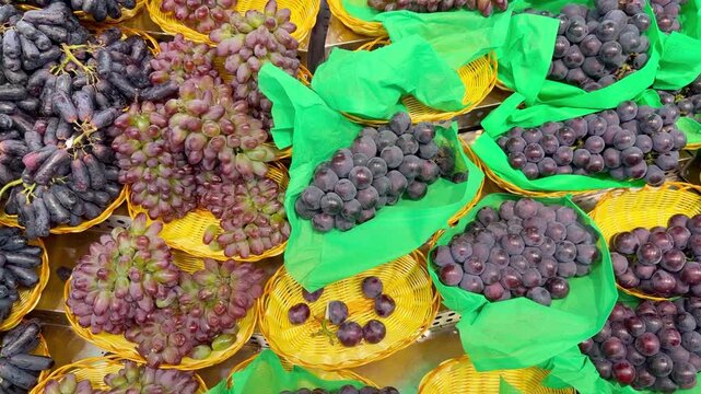 Fresh Grape Varieties in Supermarket Fruit Section &ndash; Green, Red and Black Table Grapes on Display