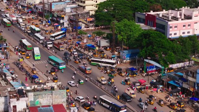 Patancheru Bus Terminal Complex with TGSRTC buses, auto stand, traffic flow and national highway 65 at Patancheruvu, hyderabad, telangana, india. day time, static shot, drone shot, 4k.