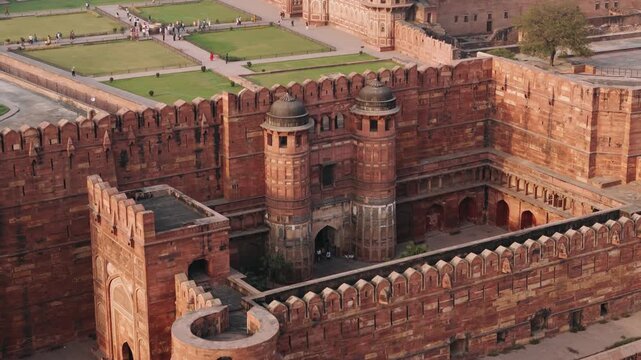 Aerial view of the historic agra fort, a unesco world heritage site with tourists walking in the courtyard