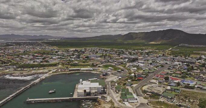 Gansbaai South Africa Aerial v22 flyover around the harbor, town center and residential districts with coastal mountain views - Shot with Mavic 3 Pro Cine - Jan 8th 2024