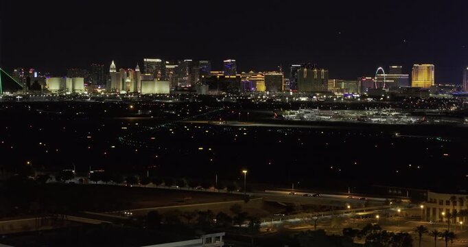 Las Vegas Nevada Aerial v113 telephoto night flyover over Paradise airport runways toward the illuminated Strip, Sphere and High Roller - Shot with Mavic 3 Pro Cine - May 1st 2024