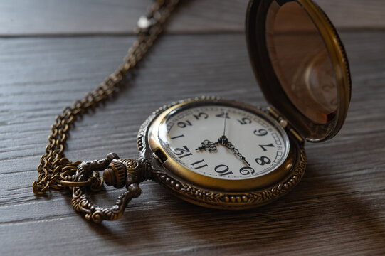 vintage pocket watch with glass lid and chain
