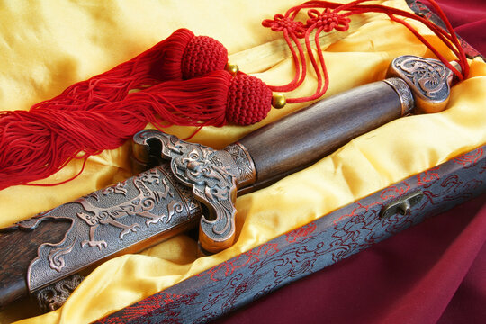 A Chinese double sword for fitness dancing in a silk box