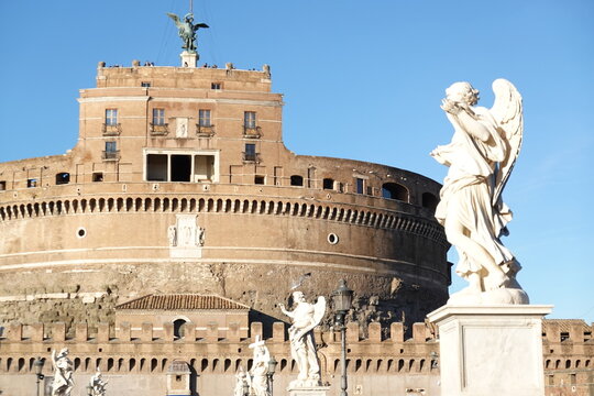 The historic Castel Sant Angelo fortress with a beautiful baroque angel sculpture in Rome, Italy.
