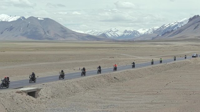 Aerial View of Tourists bike Riding Through Himalayan Valley in Ladakh India