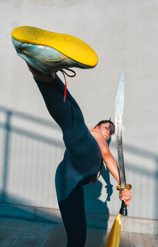 Chinese young woman practicing wushu kung fu.