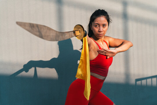 Chinese young woman practicing wushu kung fu.