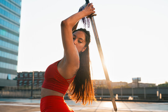 Chinese young woman practicing wushu kung fu.