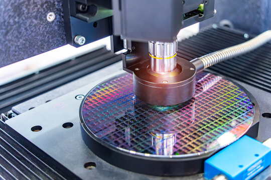 Silicon Wafers with microchips used in electronics for the fabrication of integrated circuits under the microscope,integrated circuits to manufacture CPU and GPU