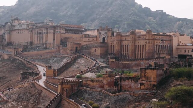 Aerial view of the amber fort, amer palace, and maota lake in jaipur, rajasthan, showing ancient indian architecture