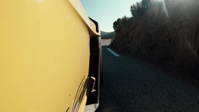 Car Driving on a Winding Mountain Road, Exterior Tracking Shot in Summer, Warm Sunny Weather, Scenic Road Trip and Vacation Travel