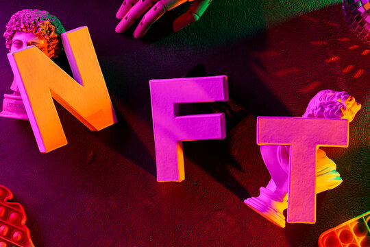 Classical sculpture busts with NFT letters disco ball and vibrant neon gradient lighting concept