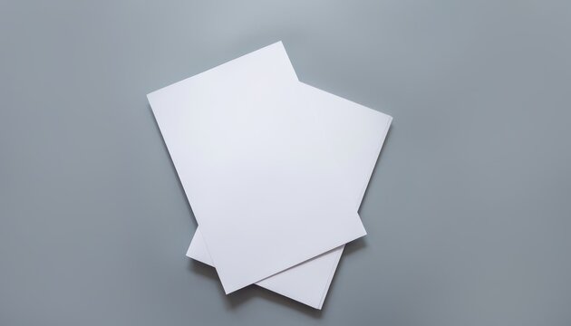 Blank white paper sheets mockup on grey background.