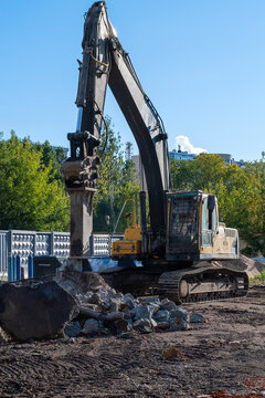 Excavator with Hydraulic Breaker at Demolition Site