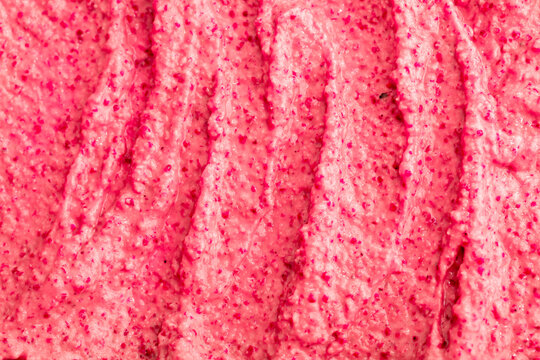 Fruit pink ice cream. Yogurt smoothie with fresh fruits and berries. Ice cream texture. Delicious sweet dessert close-up as background.