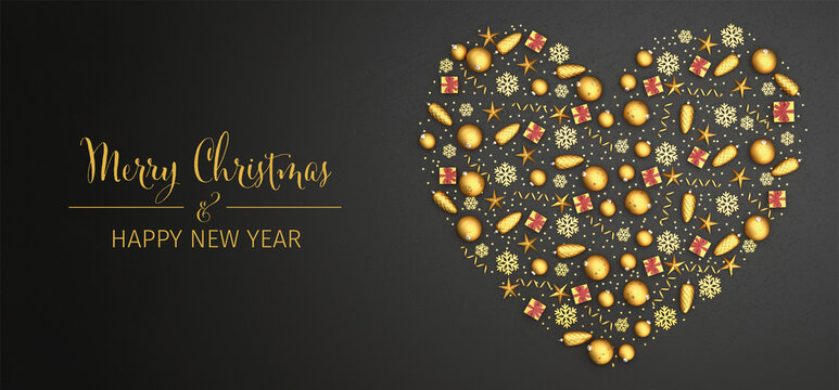 Flat lay golden christmas ornaments arranged as a heart on a black stone plate. Text Merry Christmas & Happy New Year. Web banner