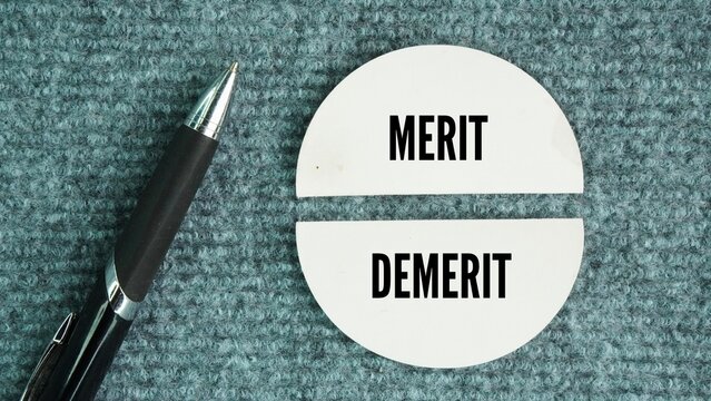 Pen with the words Merit and Demerit. noun. a quality deserving blame. Merit, demerit and its retributions at the level of the individual.