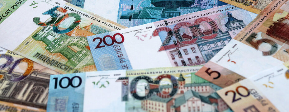 Belarusian ruble money banknotes pile on table. Belarus bills of BYN currency close up