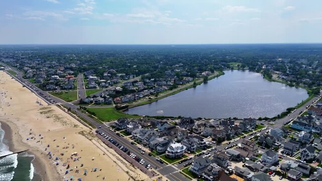 Aerial view of Belmar Beach, residential area and Lake Como on a sunny day