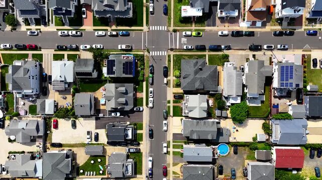Aerial top-down shot panning down over Belmar, New Jersey residential streets on a sunny