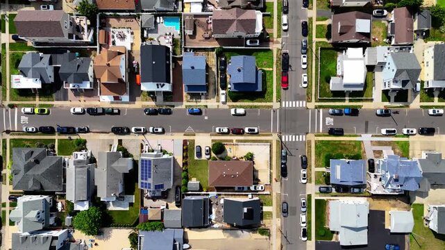 Top-down, birds-eye view of sunny residential neighborhood, grid streets and cars in Belmar, New Jersey