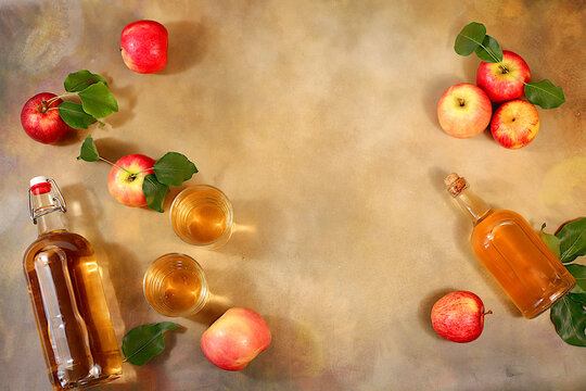 Autumn banner.Apple cider, juice or fruit drink and ingredients on a sunny table. The concept of diet and weight loss. Apples help cleanse the body and reduce weight. Healthy food, body detoxification