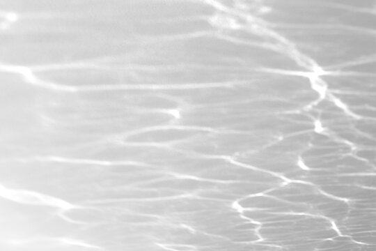 Real shimmering water caustic shadow cut out on a transparent png background with soft wavy edges. Drops into a serene wellness overlay, a psychedelic and trippy abstract composition as a transparent.