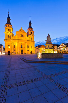 At night, the protestant town church and fountain in Ludwigsburg, Baden-Wurttemberg, Germany create a beautiful and peaceful scene