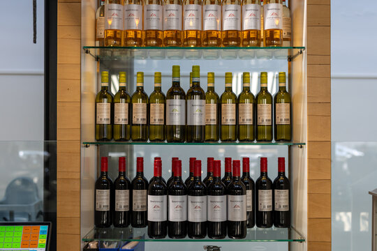 Enkhuizen, Netherlands - July 13, 2026: Bottles of Sanvigilio wine displayed on glass shelves inside a restaurant or bar, with white, ros&eacute; and red wine labels visible.