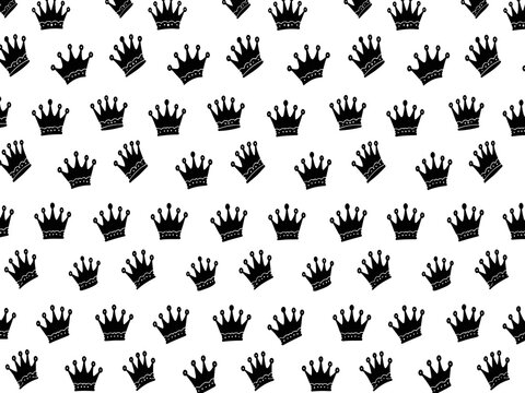 Seamless repeating pattern of black crowns on a white background creating a royal wallpaper design for elegant projects.