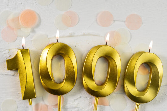 1000 followers or subscribers. card golden birthday candle one thousand on confetti background. Template for social networks, community fans.