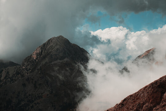 Moody Alpine Landscape of Taygetus Mountains with Clouds Swirling Around Peak