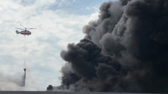 Firefighters Extinguishing Massive Warehouse Fire