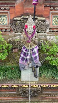 Typical statue in Pura Taman Saraswati also known as the Ubud Water Palace, is a Balinese Hindu temple in Ubud, Bali, Indonesia
