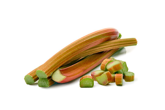 rhubarb stalks and chopped pieces on a clean white background with a top-down perspective for food photography and healthy eating themes in a natural setting with vibrant green and red hues.