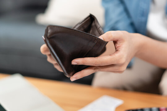 Bankruptcy problem financial concept, Young man opening empty wallet stress to find money to pay debt mortgage period