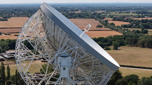 Cheshire, United Kingdom - 08 August 2026: Aerial view of the Lovell Telescope at Jodrell Bank, featuring its massive parabolic dish and steel structure above the rural landscape.