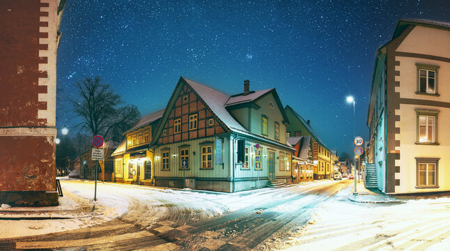 Parnu, Estonia. Night View Of Kuninga Street With Old Buildings, Houses, Restaurants, Cafe, Hotels And Shops In Evening Night Illuminations